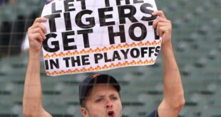 Willing his team to the playoffs, one “Don’t let the Tigers get hot” sign at a time